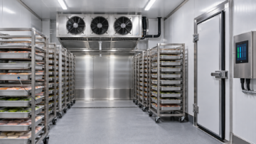Industrial blast freezer with loaded trolleys, evaporators and airflow channels relevant to Blast Freezer Energy Consumption.